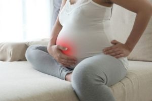 Боль у пупка при беременности