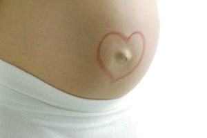 Во время беременности почему болит пупок